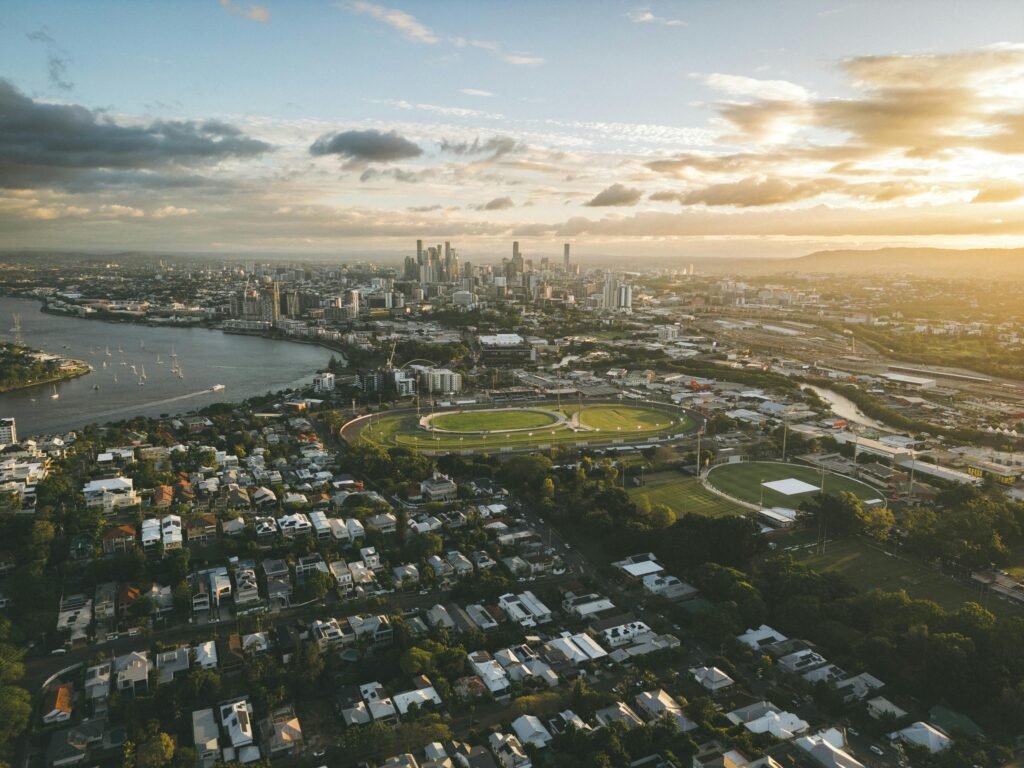 Stunning aerial view of Brisbane, Queensland at sunset with city skyline and river.